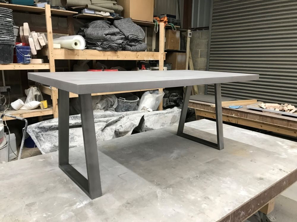 concrete dining table with box section steel legs