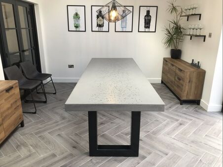 large concrete dining table with glass